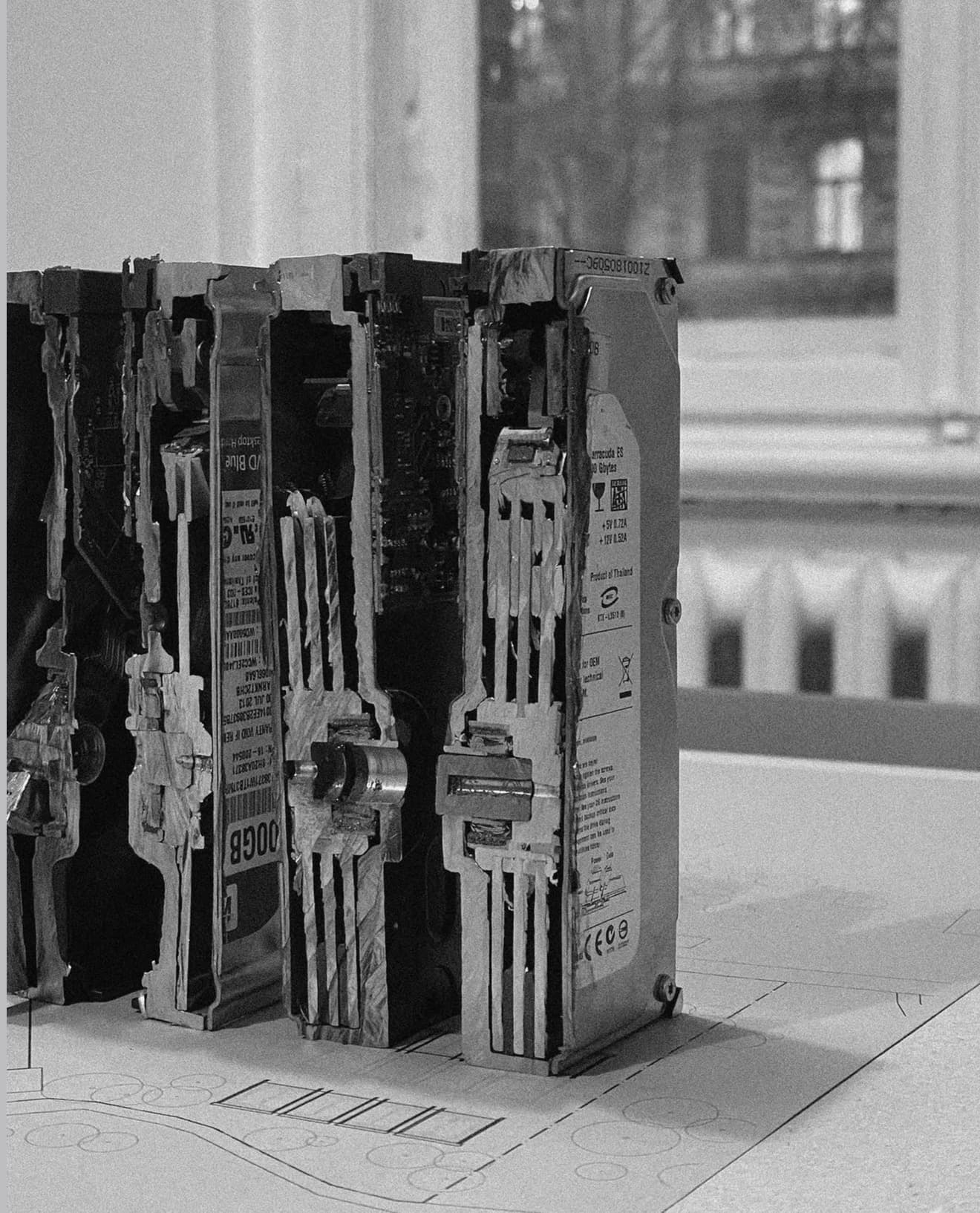 Sectioned hard drives standing upright on the master plan