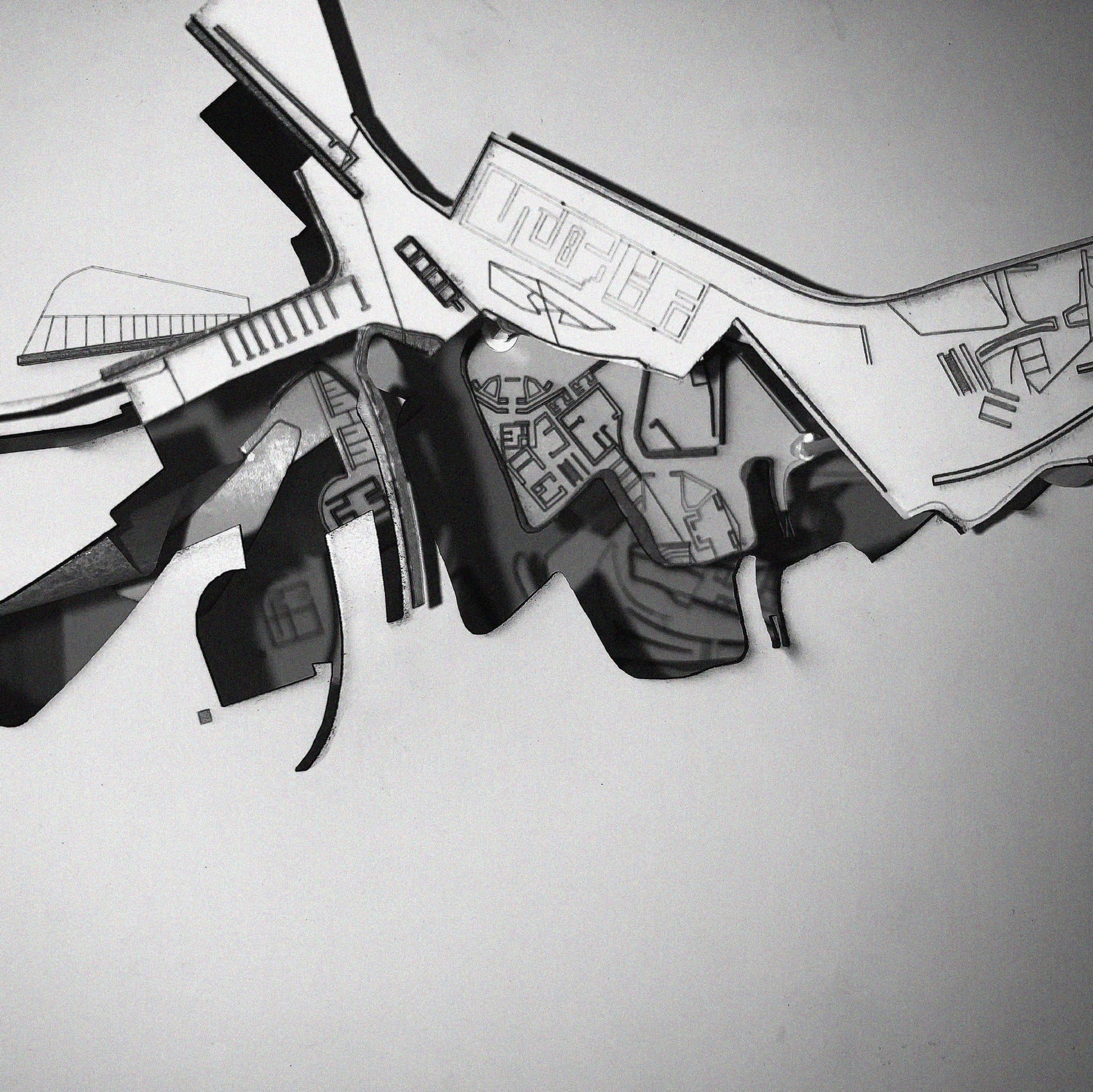Cut-plan model of the border strip — settlement fabric on one side, shadow territory on the other