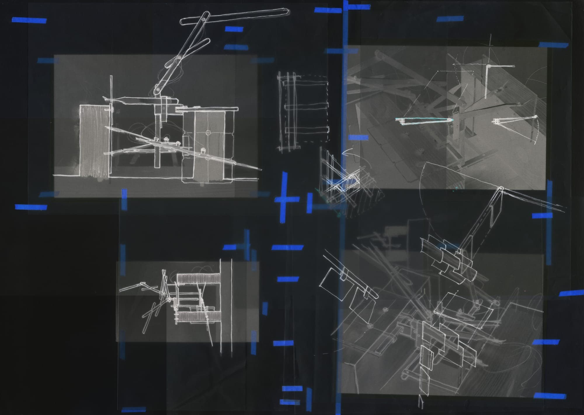 Study board — white parasite mechanism drawings taped over dark photographs of the model