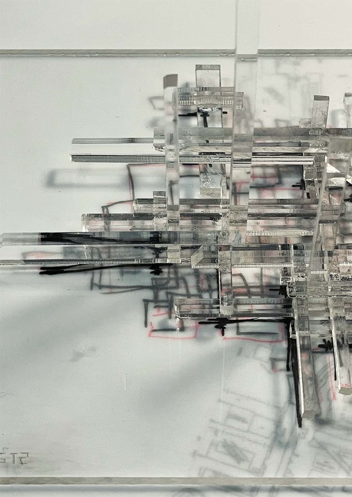 Acrylic model of SSP-2 — a lattice of clear bars interlocking above the annotated Sham Shui Po street plan, its shadows doubling the drawn city below